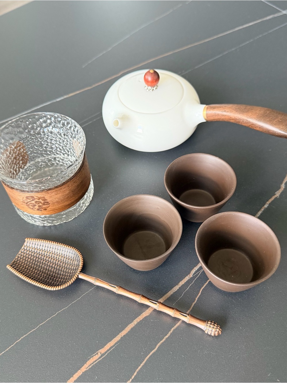 Tea set, teapot, glass cup, spoon and 3 clay cups